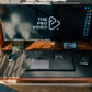 This product is a case designed for the Apple Keyboard and Trackpad, which holds them together in a single piece and mimics the surface area of a MacBook. The case allows users to dock their MacBook to a monitor while maintaining their usual workflow